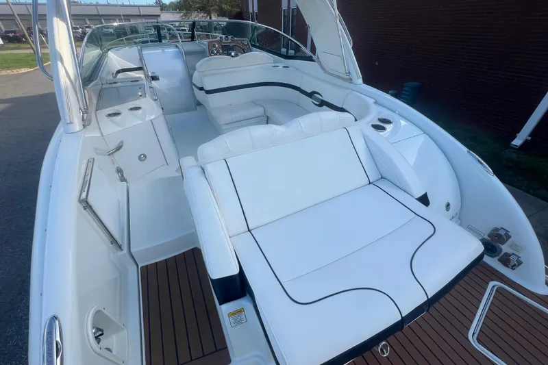 Slide: The Image of 2008 Formula 310 Sun Sport boat interior with white seating and wood accents. - 59