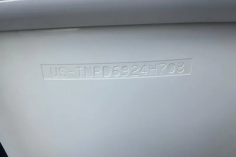 Slide: The Image of 2008 Formula 310 Sun Sport boat hull identification number (HIN) embossed on white surface. - 62