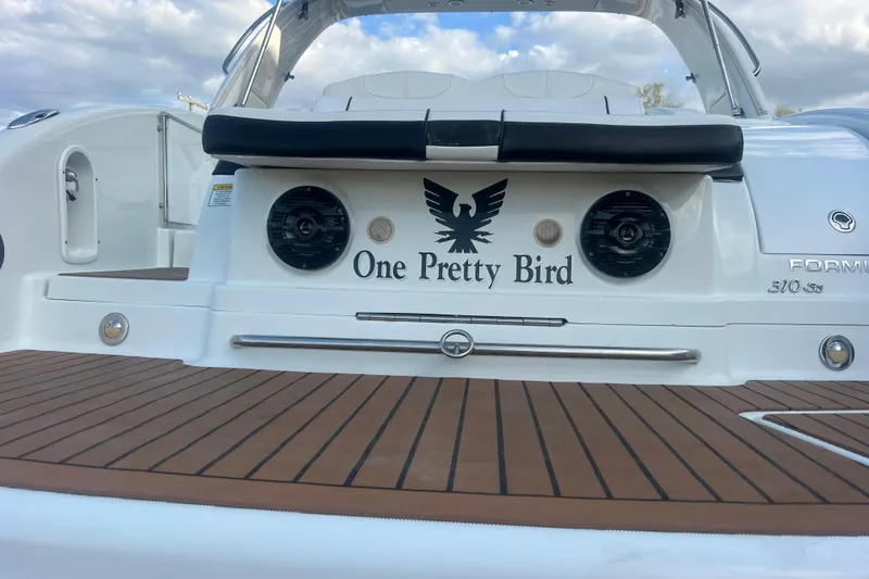 Slide: The Image of 2008 Formula 310 Sun Sport boat with "One Pretty Bird" name on the stern. - 63