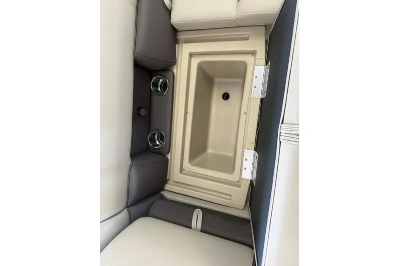 Slide: The Image of 2026 Bentley Pontoons Legacy 243 DL Navigator interior seating with built-in storage compartment. - 10