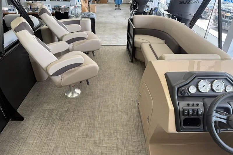 Slide: The Image of Interior of 2026 Bentley Pontoons Legacy 243 DL Navigator with plush seating and modern dashboard. - 6