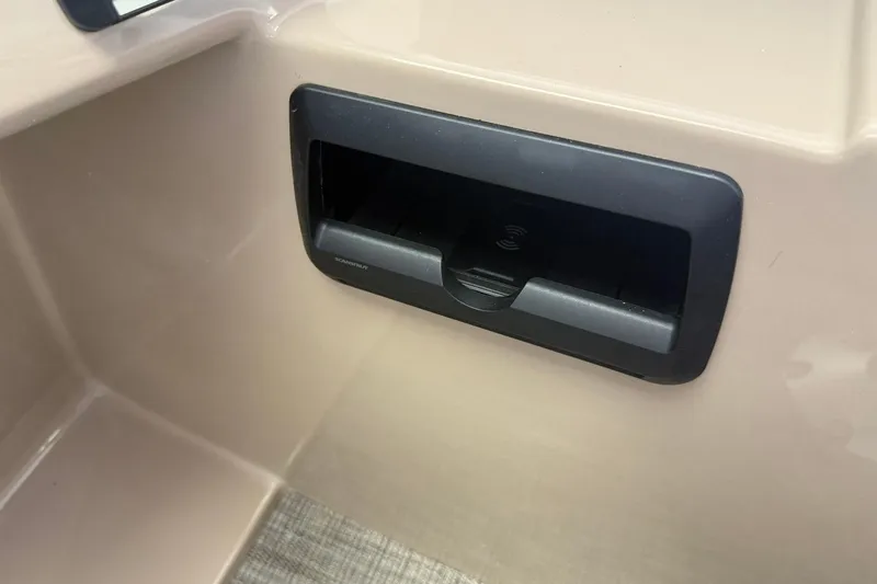 Slide: The Image of 2026 Bentley Pontoons Legacy 243 DL Navigator interior detail with built-in storage compartment. - 8