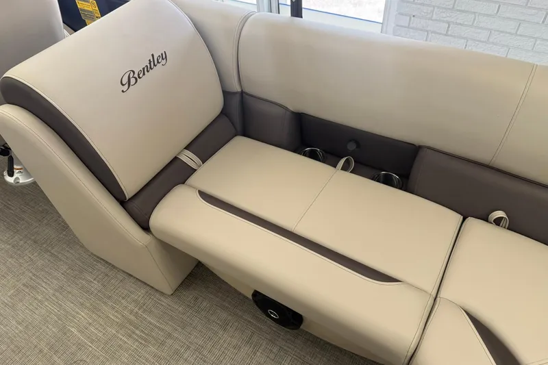 Slide: The Image of Luxurious seating in the 2026 Bentley Pontoons Legacy 243 DL Navigator boat. - 9