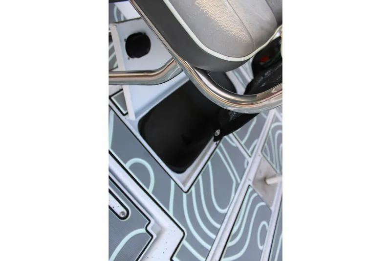 Slide: The Image of 2021 Xpress H22B Bay boat interior with patterned flooring and seating detail. - 14
