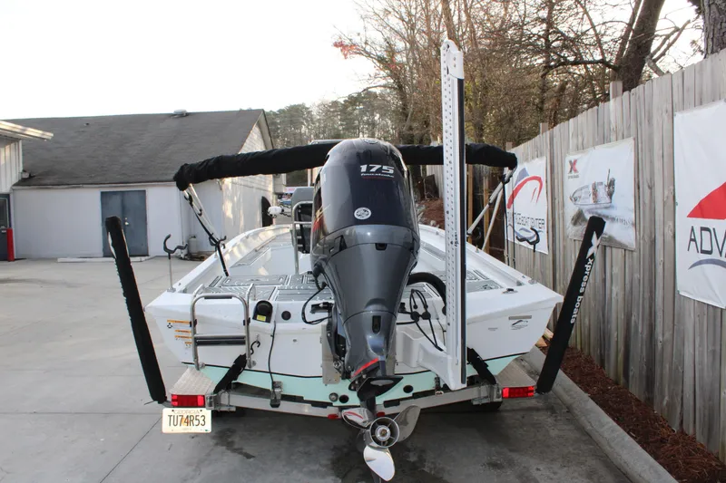 Slide: The Image of 2021 Xpress H22B Bay boat with 175 HP engine on trailer. - 3