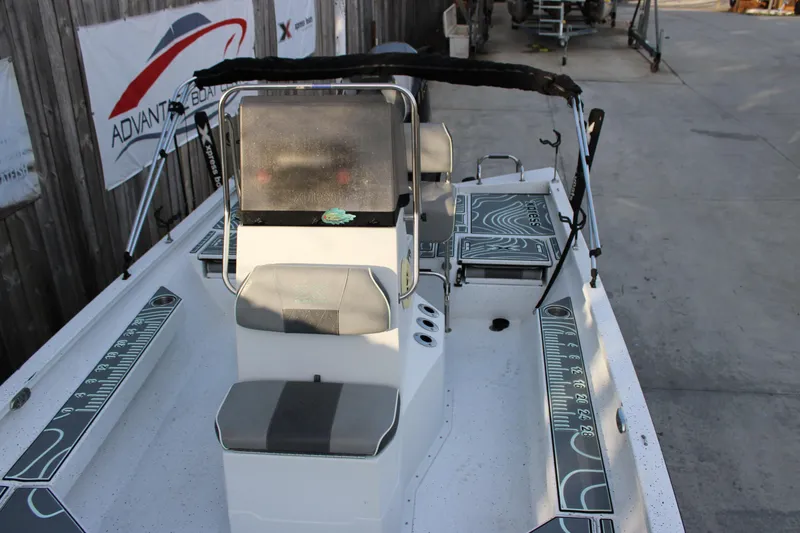 Slide: The Image of 2021 Xpress H22B Bay boat interior with seating and measurement decals. - 7