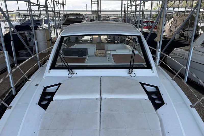 Slide: The Image of 2015 Cruisers Yachts 390 Express Coupe interior with white seating and modern design. - 10