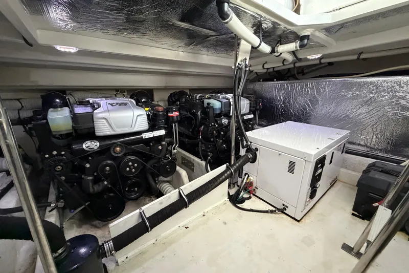 Slide: The Image of Interior view of 2015 Cruisers Yachts 390 Express Coupe, featuring sleek helm and seating. - 12