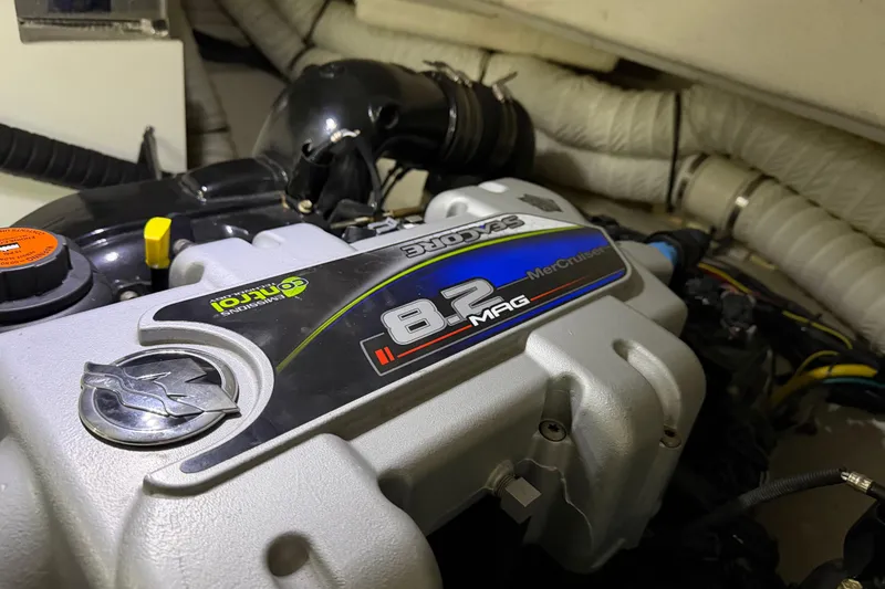 Slide: The Image of 2015 Cruisers Yachts 390 Express Coupe interior with white seating and sleek design. - 14