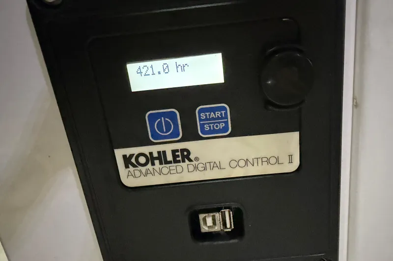 Slide: The Image of 2015 Cruisers Yachts 390 Express Coupe with sunpad, docked by the water. - 15