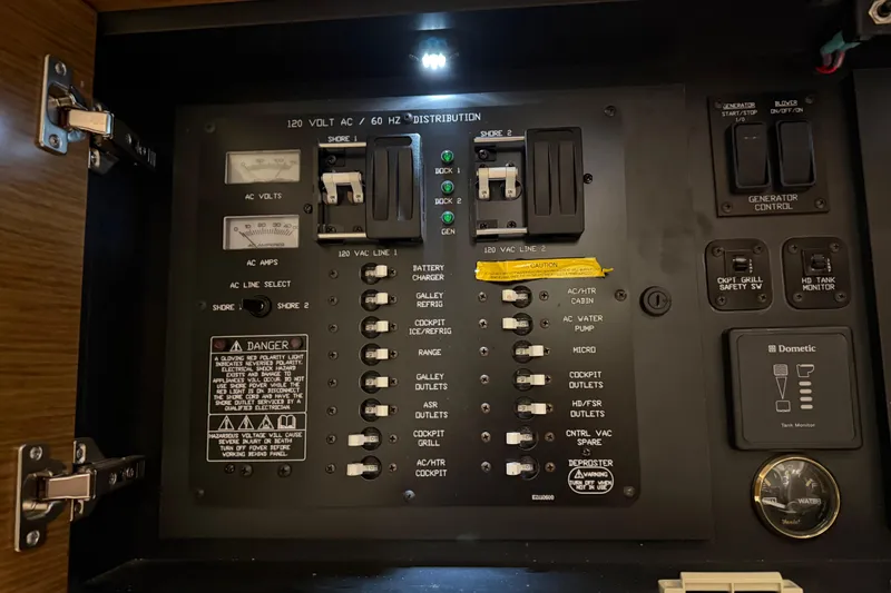 Slide: The Image of Electrical control panel of a 2015 Cruisers Yachts 390 Express Coupe. - 35