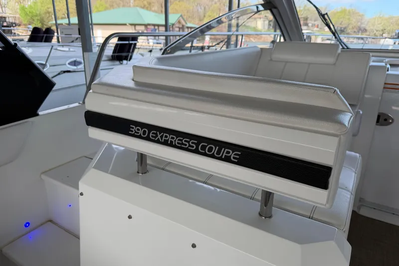Slide: The Image of 2015 Cruisers Yachts 390 Express Coupe interior with white seating and sleek design. - 8