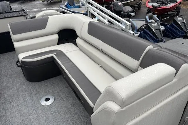 Slide: The Image of 2026 Sun Tracker Fishin' Barge 22 DLX interior with spacious seating and modern design. - 15