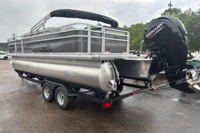 Slide: The Image of 2026 Sun Tracker Fishin' Barge 22 DLX pontoon boat with Mercury outboard motor on trailer. - 2