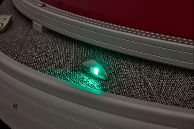 Slide: The Image of Manufacturer Provided Image: 2026 Sun Tracker Fishin' Barge 22 DLX with illuminated green navigation light. - 41