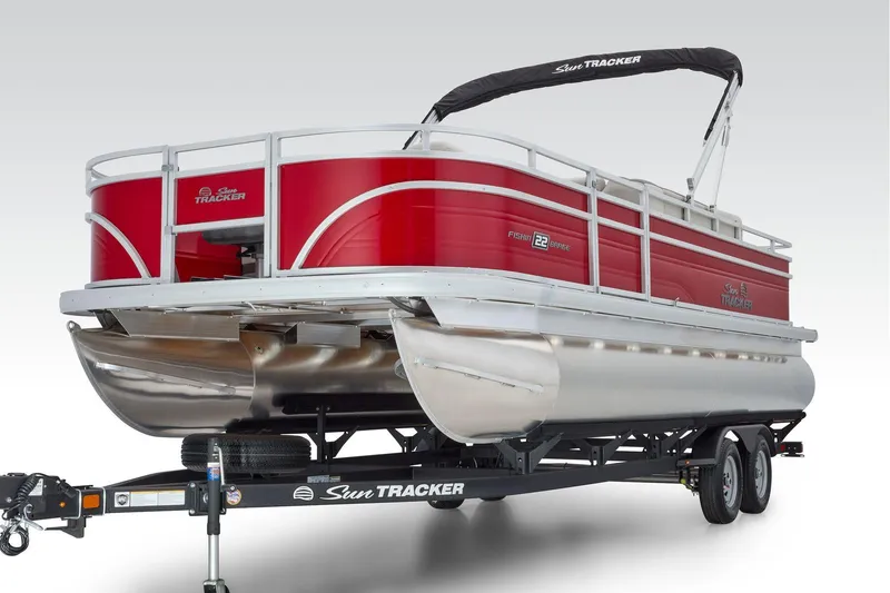 Slide: The Image of Manufacturer Provided Image: 2026 Sun Tracker Fishin' Barge 22 DLX pontoon boat on trailer, red exterior. - 44