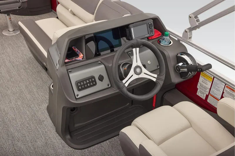 Slide: The Image of Manufacturer Provided Image: 2026 Sun Tracker Fishin' Barge 22 DLX helm with steering wheel and control panel. - 61