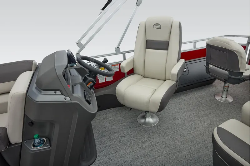 Slide: The Image of Manufacturer Provided Image: 2026 Sun Tracker Fishin' Barge 22 DLX interior with steering console and seating. - 66