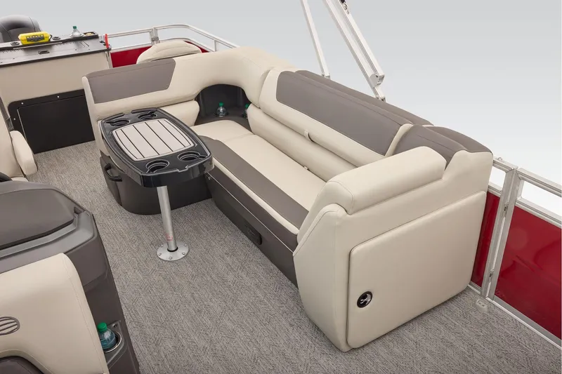 Slide: The Image of Manufacturer Provided Image: 2026 Sun Tracker Fishin' Barge 22 DLX interior with beige seating and table. - 68