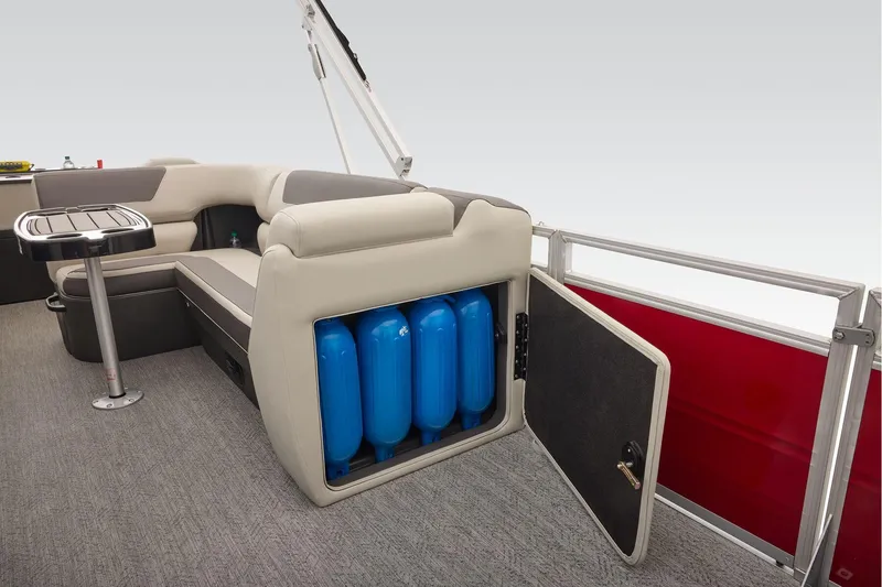 Slide: The Image of Manufacturer Provided Image: 2026 Sun Tracker Fishin' Barge 22 DLX interior with seating and storage compartment. - 69