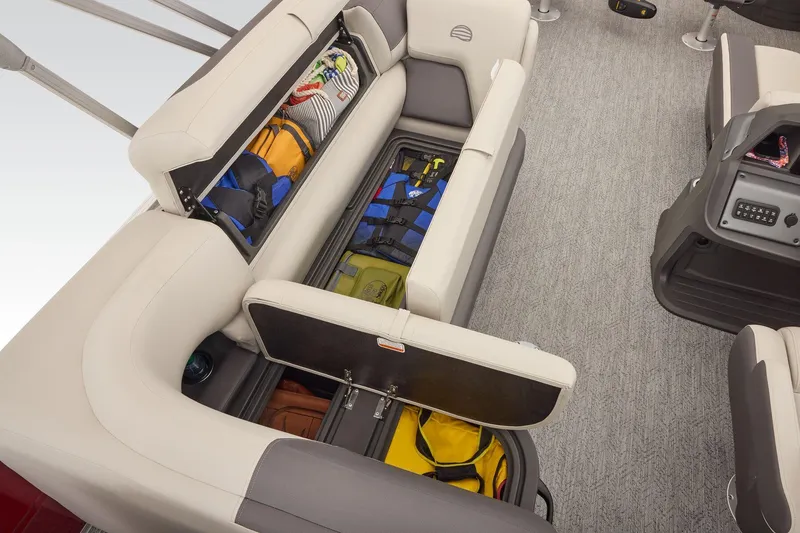 Slide: The Image of Manufacturer Provided Image: 2026 Sun Tracker Fishin' Barge 22 DLX with open storage compartments and seating. - 72