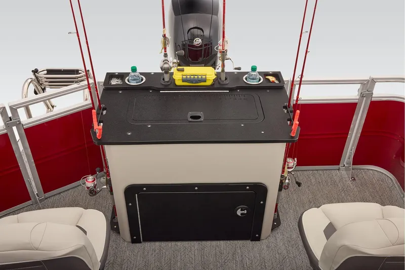 Slide: The Image of Manufacturer Provided Image: 2026 Sun Tracker Fishin' Barge 22 DLX interior with fishing rods and seating. - 75