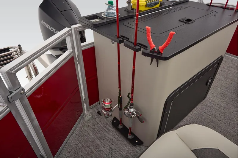 Slide: The Image of Manufacturer Provided Image: 2026 Sun Tracker Fishin' Barge 22 DLX fishing setup with rods and storage. - 79