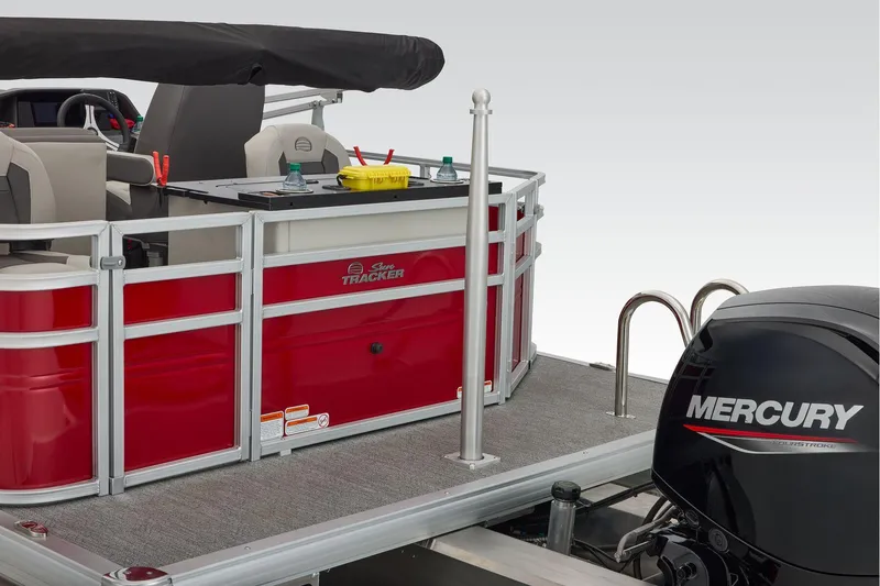 Slide: The Image of Manufacturer Provided Image: 2026 Sun Tracker Fishin' Barge 22 DLX with Mercury engine, red and gray design. - 85