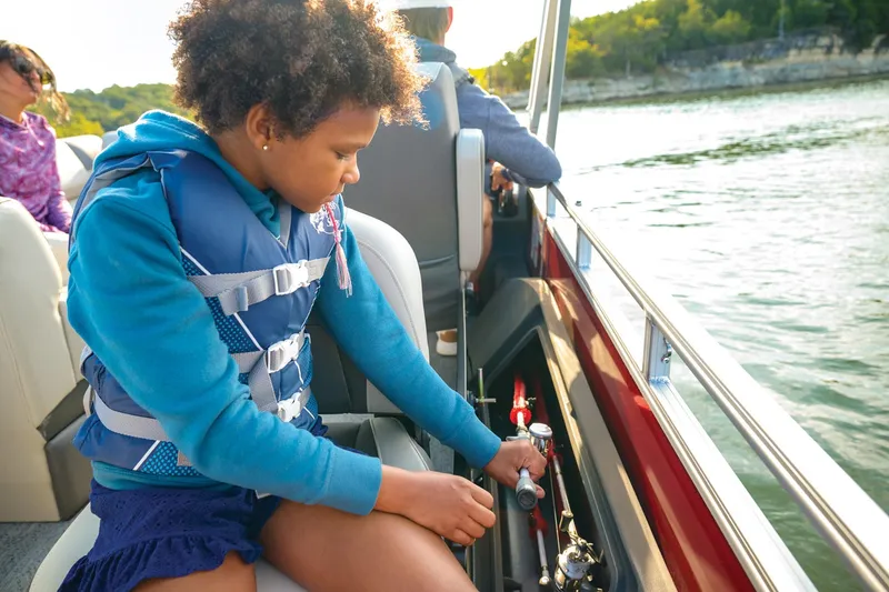 Slide: The Image of Manufacturer Provided Image: Child fishing on a 2026 Sun Tracker Fishin' Barge 22 DLX boat. - 97