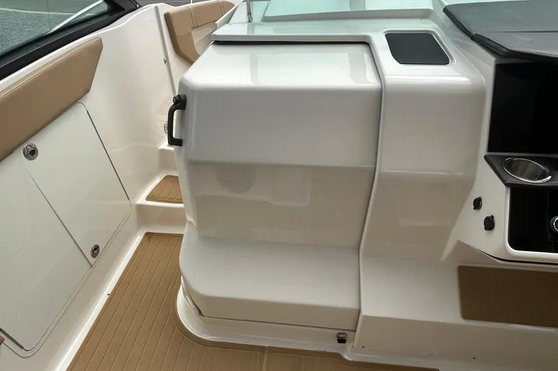 Slide: The Image of Interior view of 2022 Sea Ray Sundancer 320 Outboard, featuring sleek seating and modern design. - 17