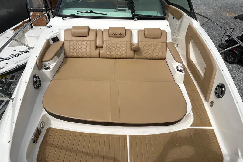 Slide: The Image of Luxurious seating area on 2022 Sea Ray Sundancer 320 Outboard boat, featuring tan upholstery. - 20