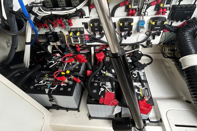 Slide: The Image of Electrical system of a 2022 Sea Ray Sundancer 320 Outboard, featuring batteries and wiring. - 29