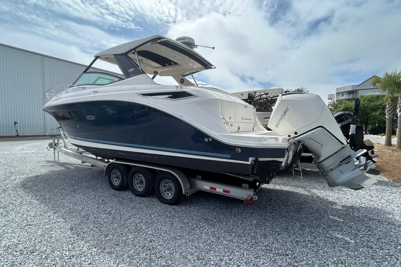 Slide: The Image of 2022 Sea Ray Sundancer 320 Outboard on trailer, featuring sleek design and powerful Mercury engines. - 5