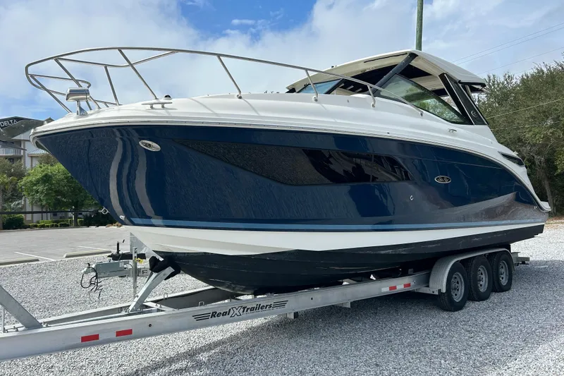 Slide: The Image of 2022 Sea Ray Sundancer 320 Outboard on trailer, parked outdoors. - 7