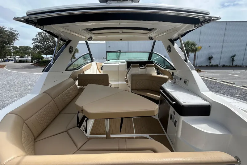Slide: The Image of 2022 Sea Ray Sundancer 320 Outboard interior with luxurious seating and modern amenities. - 8