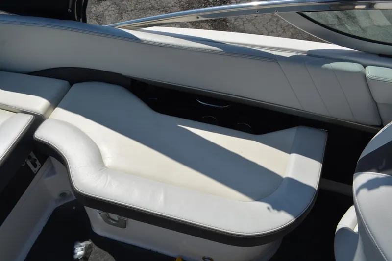 Slide: The Image of 2014 Regal 2300 Bowrider interior seating with white upholstery and sleek design. - 11