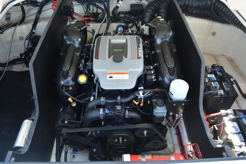 Slide: The Image of Engine compartment of a 2014 Regal 2300 Bowrider, showcasing the powerful motor and components. - 14