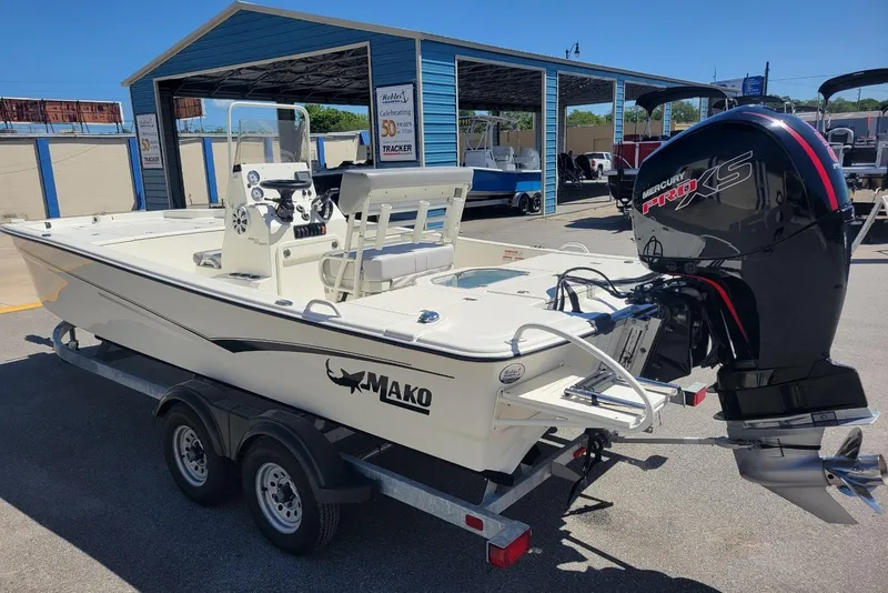 Slide: The Image of 2025 Mako Pro Skiff 19 CC boat with Mercury Pro XS engine on trailer. - 4