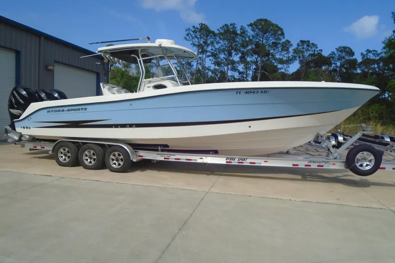 The Image of 2004 Hydra-Sports Vector 3300 CC boat on trailer, parked outdoors. - 0