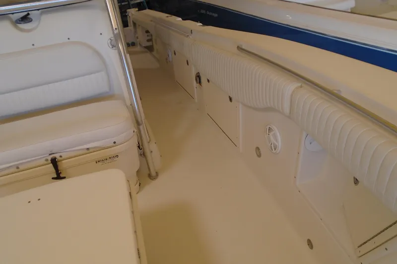 Slide: The Image of 2004 Hydra-Sports Vector 3300 CC interior with cushioned seating and storage compartments. - 23