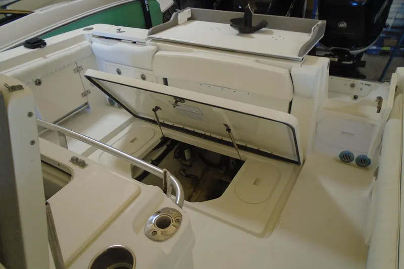 Slide: The Image of 2004 Hydra-Sports Vector 3300 CC boat interior with open storage compartments and seating. - 26