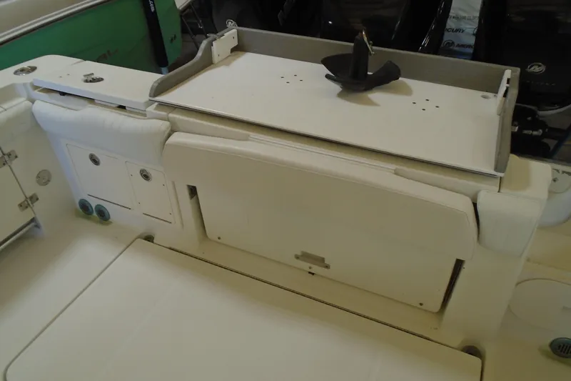 Slide: The Image of 2004 Hydra-Sports Vector 3300 CC boat interior with storage compartments and seating. - 27