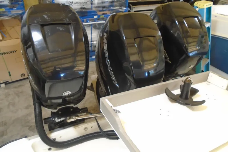 Slide: The Image of Triple Mercury outboard engines on a 2004 Hydra-Sports Vector 3300 CC boat. - 28