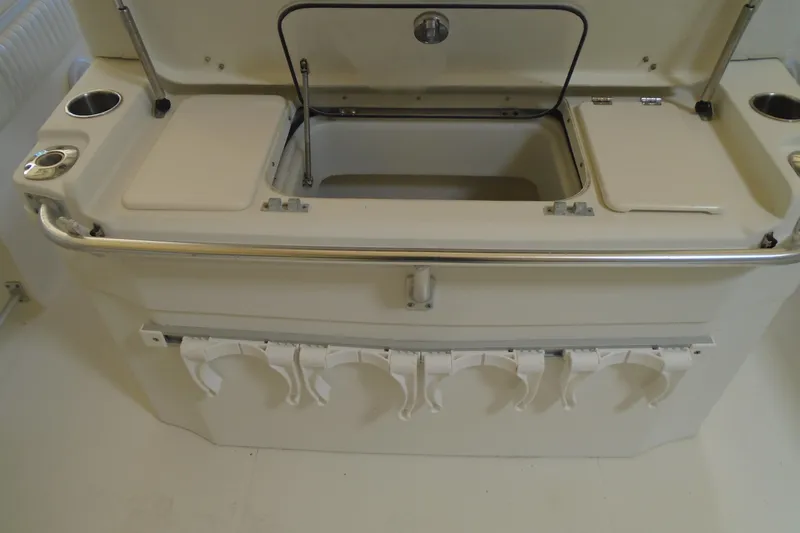 Slide: The Image of 2004 Hydra-Sports Vector 3300 CC boat interior with storage compartments and cup holders. - 29
