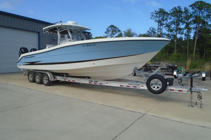 Slide: The Image of 2004 Hydra-Sports Vector 3300 CC boat on trailer, parked outdoors. - 3