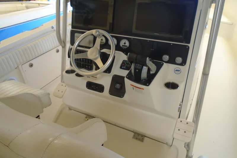Slide: The Image of 2004 Hydra-Sports Vector 3300 CC helm with steering wheel and controls. - 30