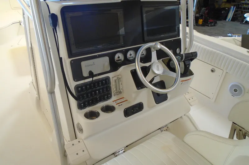 Slide: The Image of 2004 Hydra-Sports Vector 3300 CC boat console with steering wheel and navigation equipment. - 31