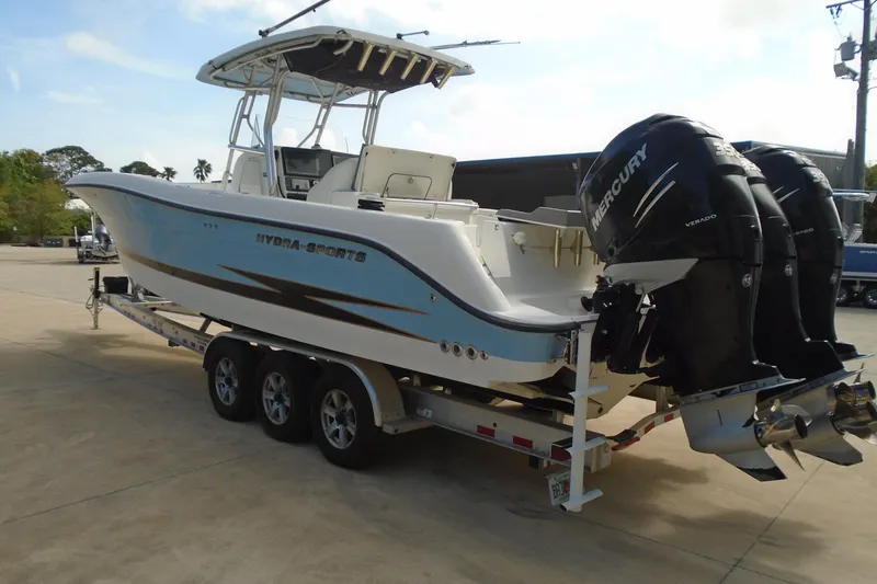 Slide: The Image of 2004 Hydra-Sports Vector 3300 CC boat on trailer with twin Mercury engines. - 6