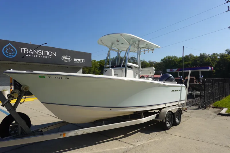 Slide: The Image of 2014 Sea Hunt Ultra 225 boat on trailer at Transition Watersports dealership. - 2