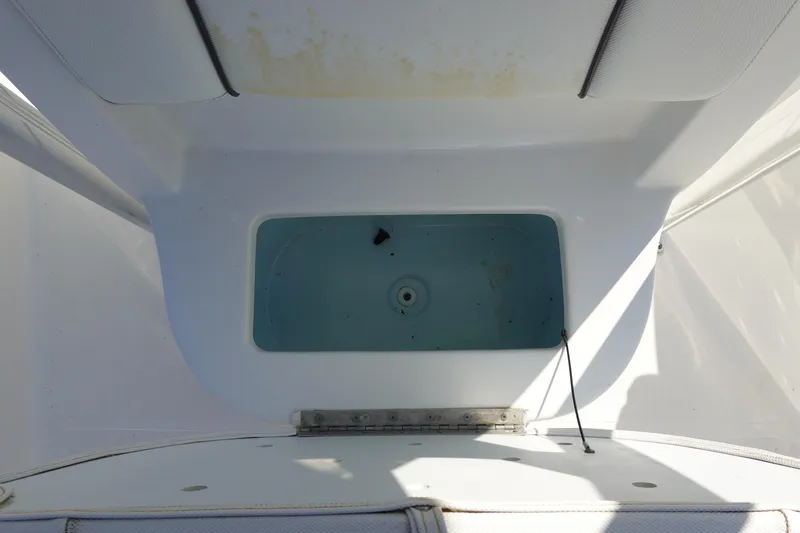 Slide: The Image of Livewell compartment on a 2014 Sea Hunt Ultra 225 boat, open and empty. - 23